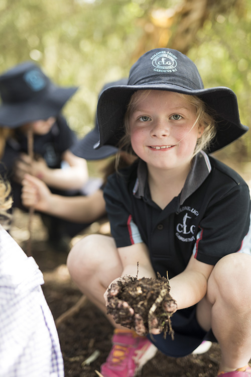 Child playing in school garden